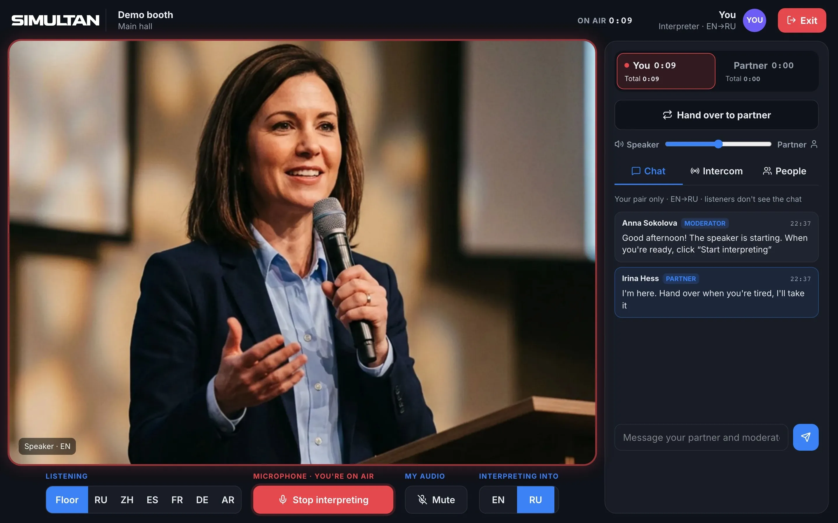 Interpreter screen on air: shift timer, a Hand over to colleague button and the pair's chat with the moderator