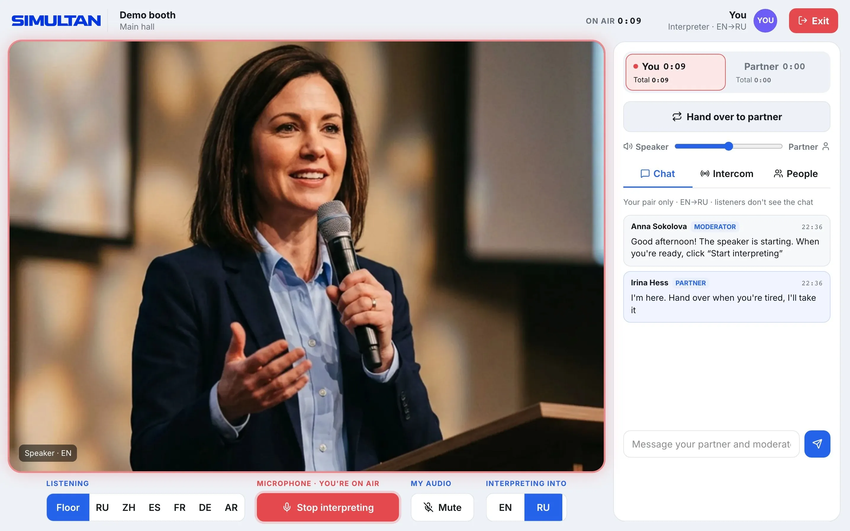 Interpreter screen on air: shift timer, a Hand over to colleague button and the pair's chat with the moderator